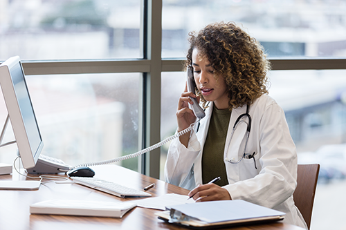 Clinician on telephone.